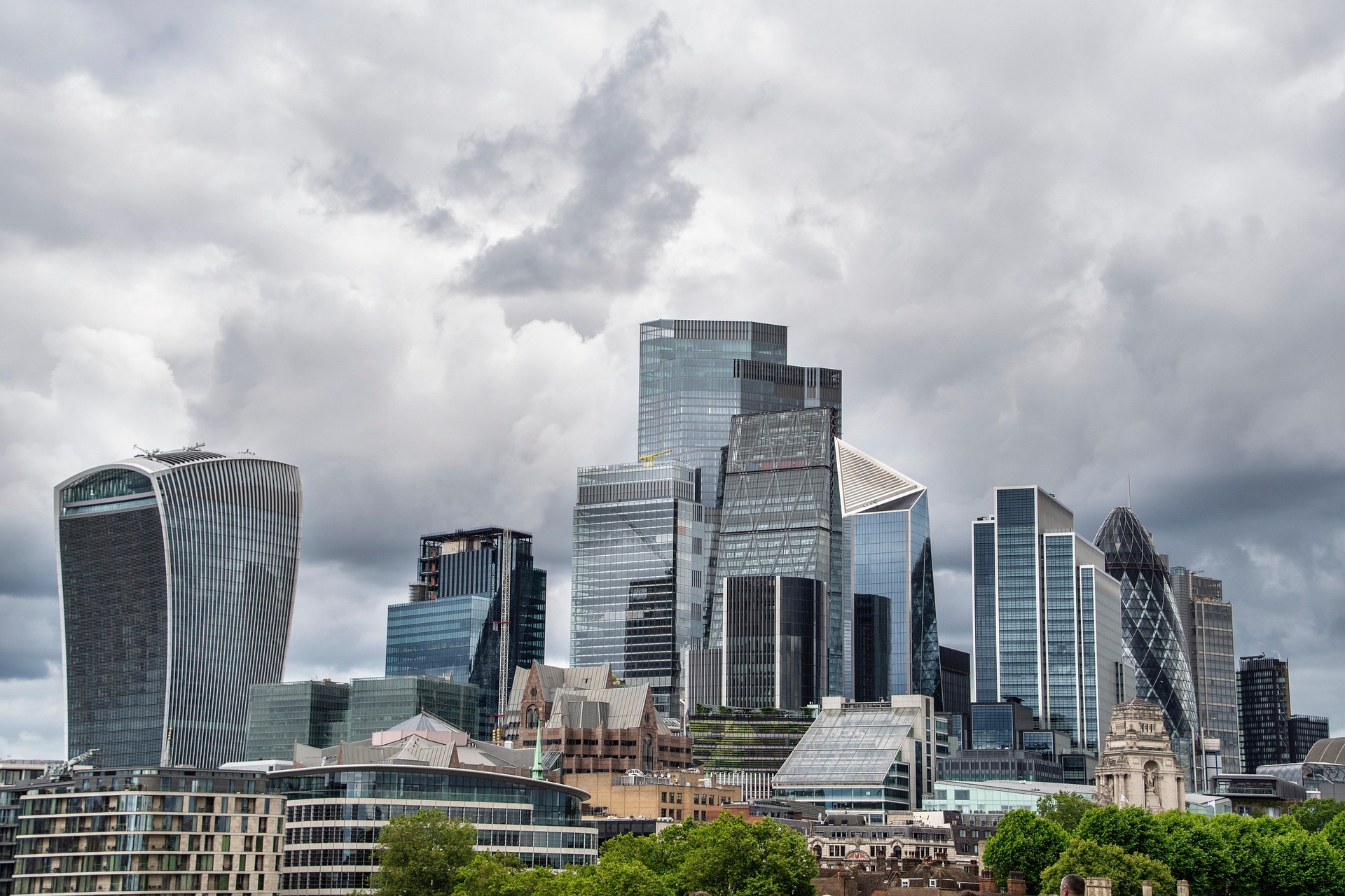 A modern interior meeting space overlooking a city skyline.